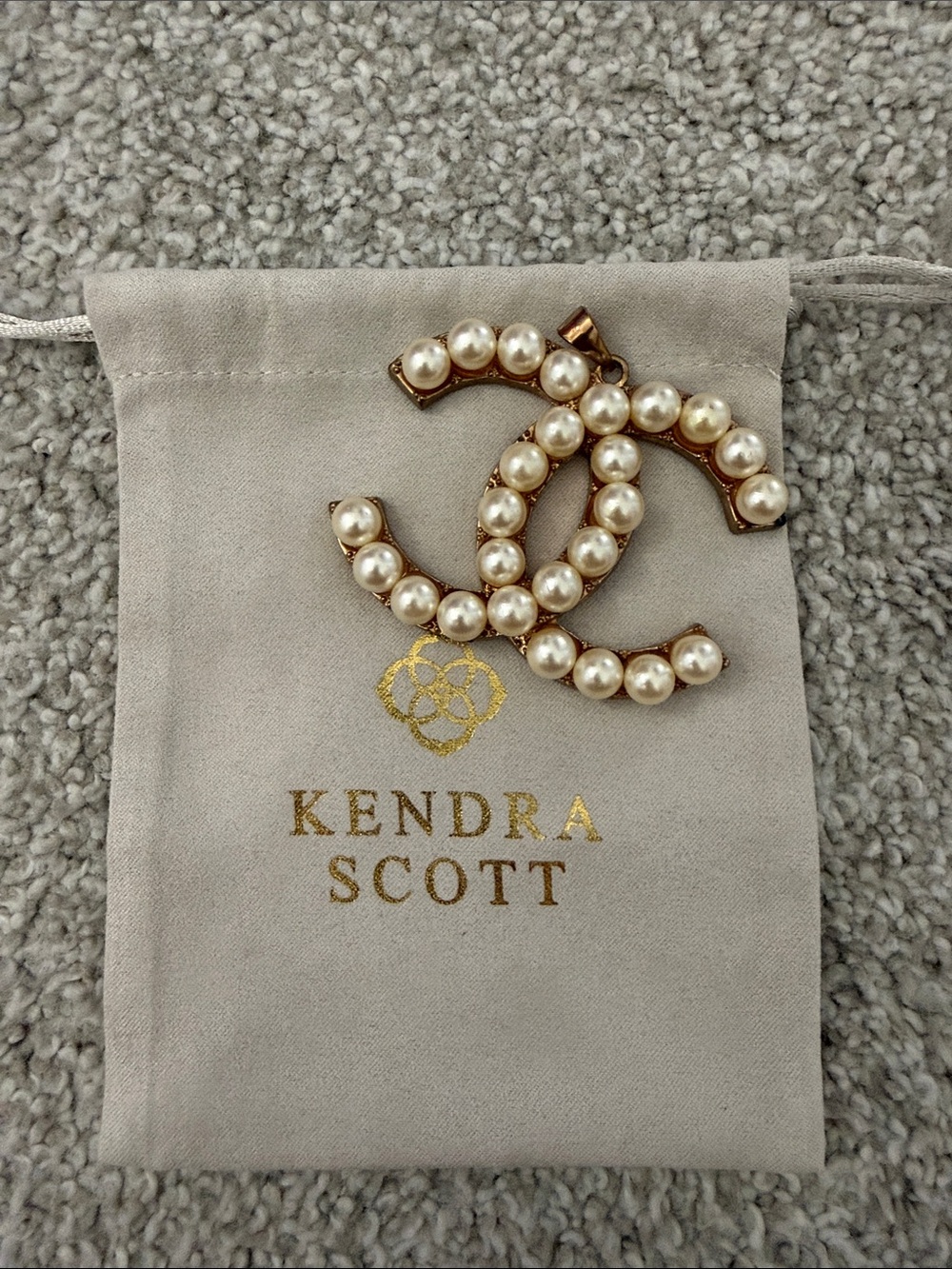 Kendra Scott dustbag with CC necklace